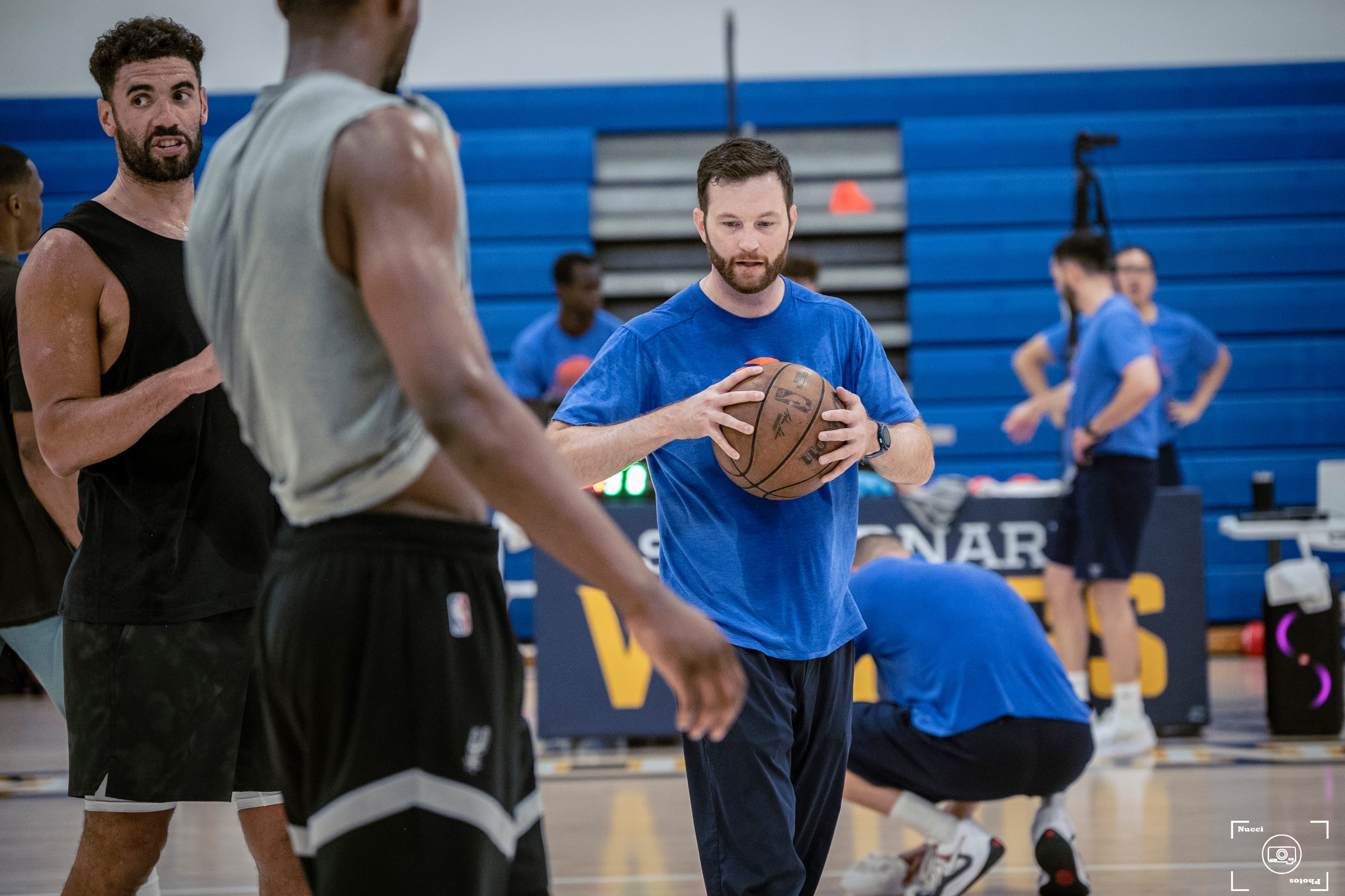 Men with basketball at indoor court